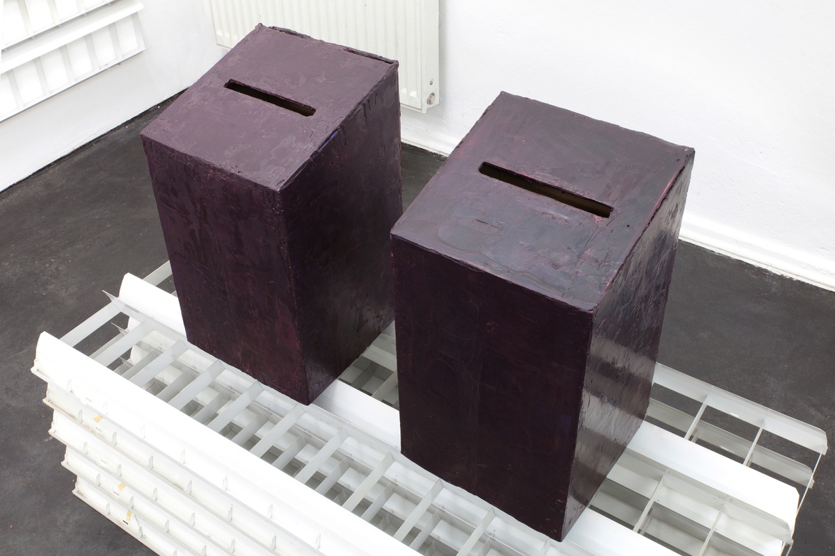 Nikolas Gambaroff, Untitled (Wahlurnen; Multiple Choice), 2019microcrystalline wax on cardboard, metal light fixturesdimensions variable
